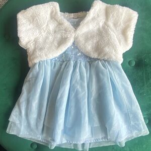 Pale blue sequinned dress with white faux fur sole